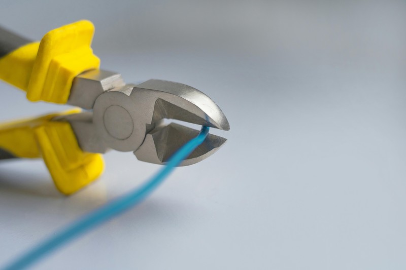 Assorted 3D printing post-processing tools including flush cutters, deburring tool, and needle files