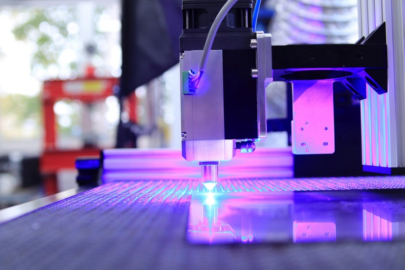 An array of functional 3D printed parts made from carbon fiber filament including brackets and mounts