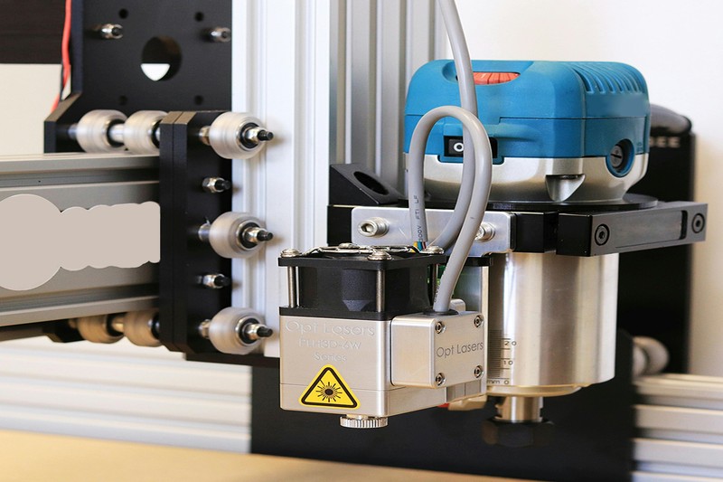 A sealed 3D printer enclosure with a polycarbonate print visible inside