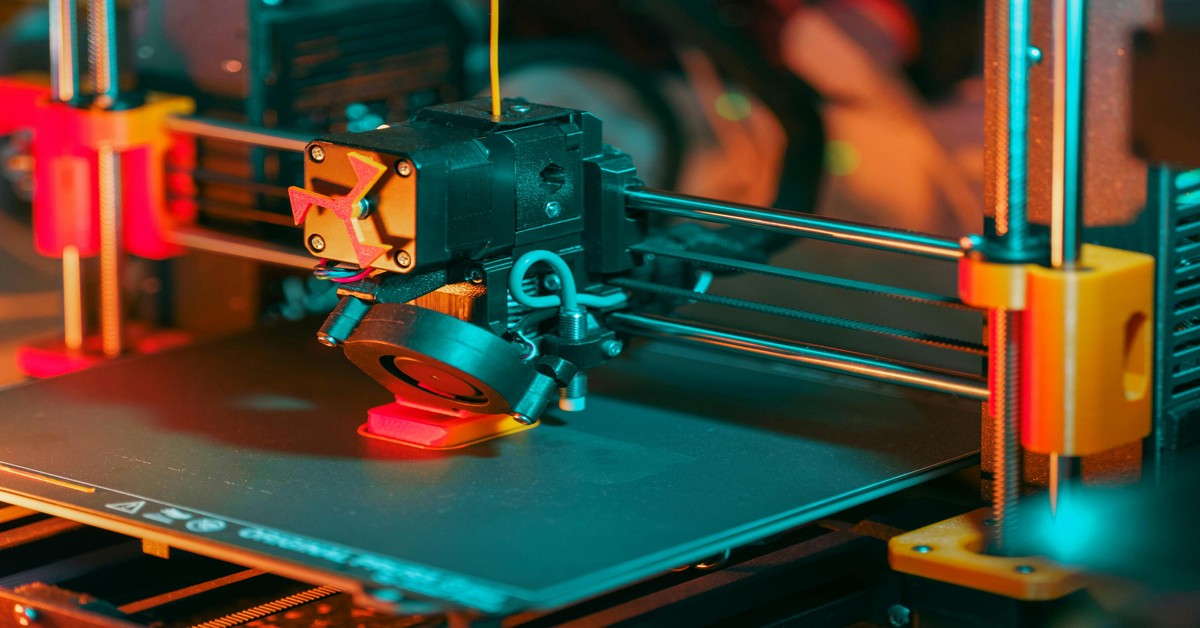 A 3D printer actively printing a complex STL model on the print bed