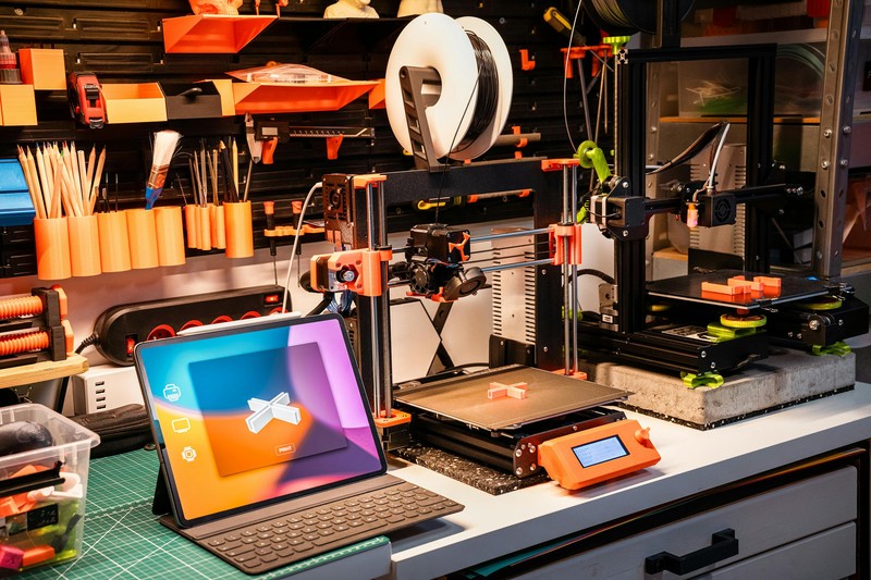 Bambu Lab X1 Carbon 3D printer printing a prototype part at high speed
