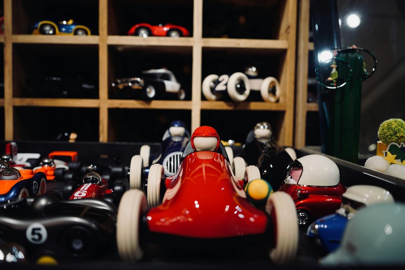 A collection of colorful 3D printed miniatures displayed on a shelf