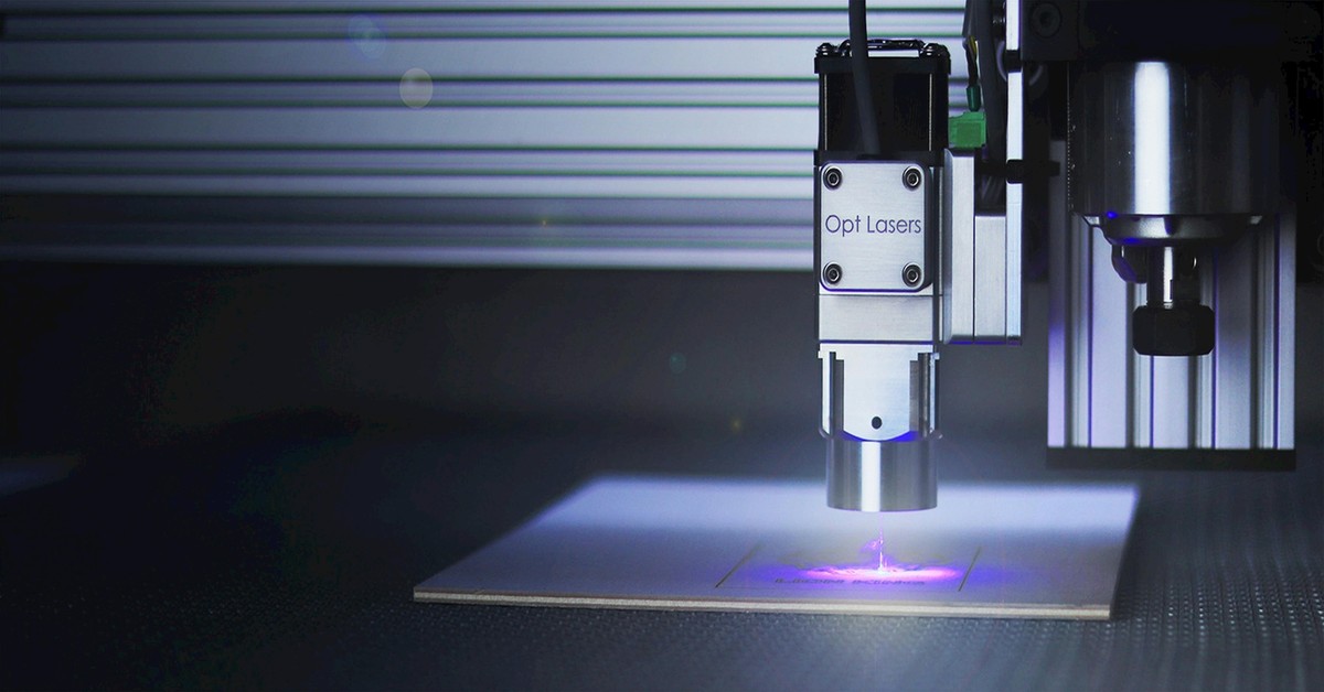 Close-up of a CoreXY 3D printer gantry showing dual belts and XY joint