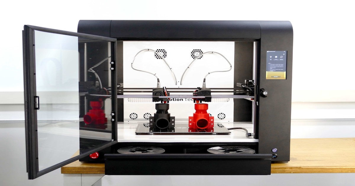 An IDEX 3D printer printing two identical parts in duplicate mode with both extruders active