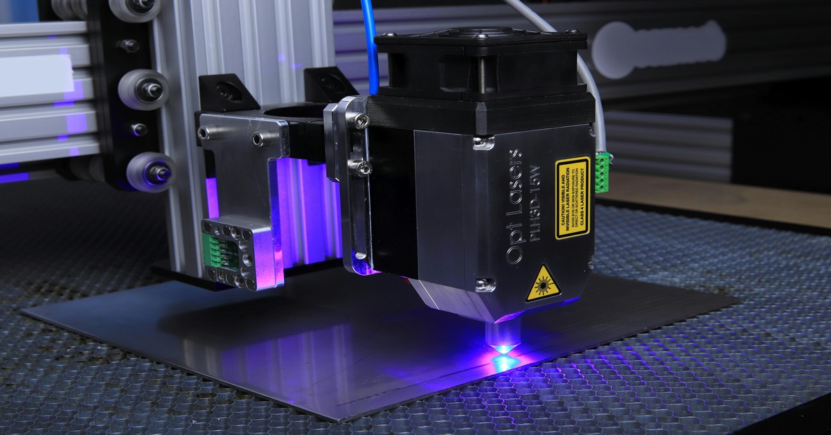 Close-up comparison of a linear rail and a V-slot wheel on a 3D printer gantry