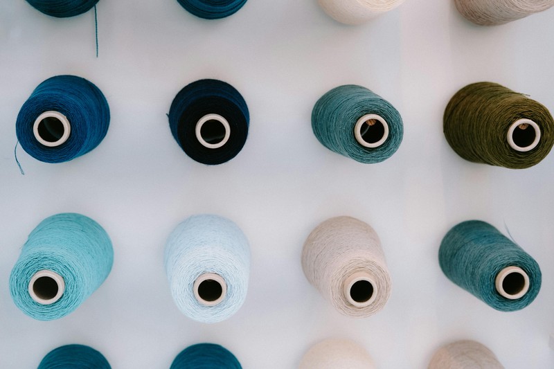 Multiple spools of matte PLA filament in various colors for 3D printing miniatures